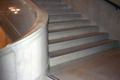 THE PROVISO: At the bottom of the Sculpture Hall staircase , where Giselle makes the turn to lead Bryce up to the Chinese temple room.