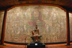 GUANYIN OF THE SOUTHERN SEA against THE ASSEMBLY OF TEJAPRABHA | THE PROVISO: The bodhisattva before which Giselle meditates—before Bryce undresses her in front of it.