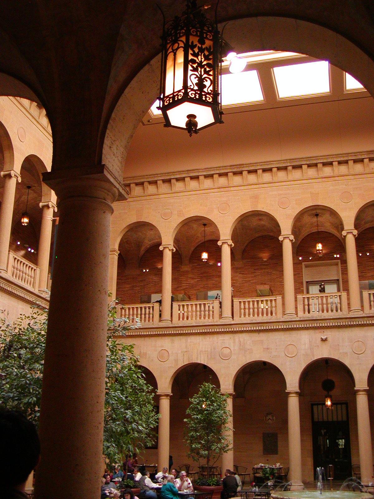 Rozzelle Courtyard in the Nelson-Atkins art gallery in Kansas City, Missouri, a Tuscan-inspired two-story courtyard with a fountain in the middle and arcades on both levels.