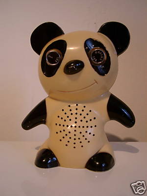 A small plastic panda that is a transistor radio. The eyes are knobs, and the belly is the speaker.