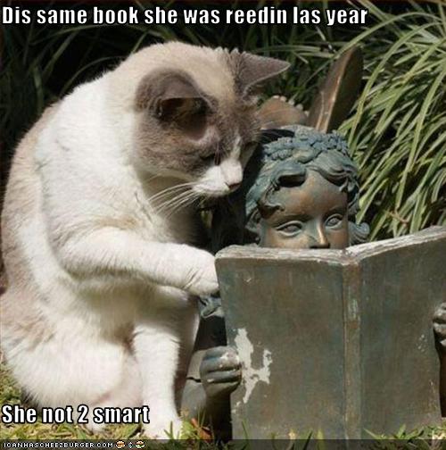 Meme of a brass fairy garden ornament reading a book, with a cat looking over its shoulder with the text “Dis same book she was reedin las year She not 2 smart.”