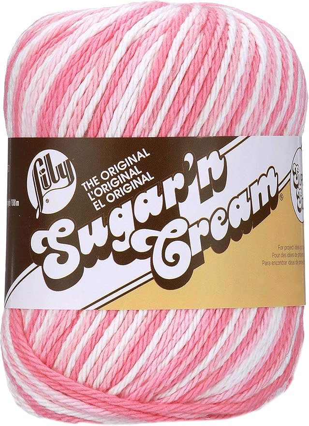 A ball of variegated white to dark pink Sugar’n Cream cotton yarn by Lily.