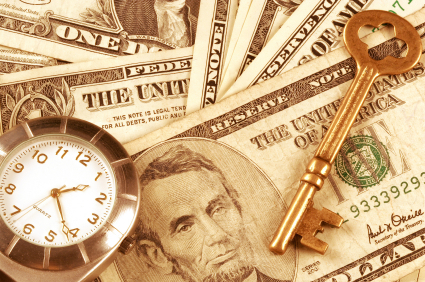 An image of US currency, an old skeleton key, and a pocketwatch.