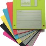 An image of a stack of multicolored 3-1/2" floppy disks.