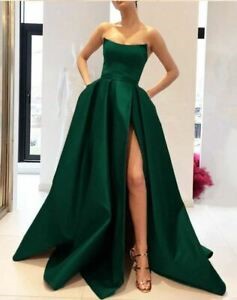 Woman in a long, green taffeta evening gown.